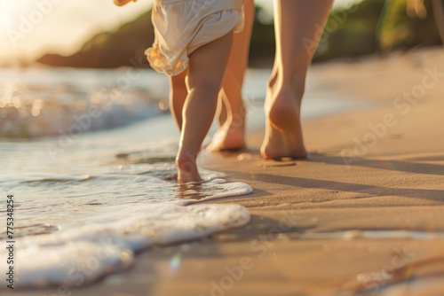 A mother and her child are walking on the beach