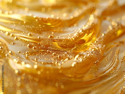 A close up of a golden liquid with bubbles on the surface