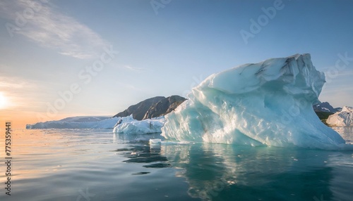 melting icebergs by the coast of greenland on a beautiful summer day melting of a iceberg and pouring water into the sea global warming arctic nature landscape summer day