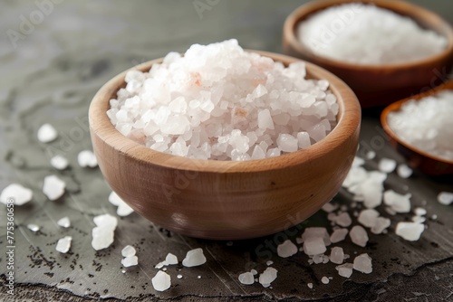 A bowl of salt is on a table
