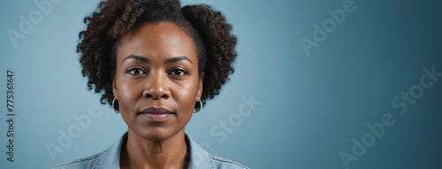 A 50S Adult African American Woman Isolated On A Light Blue Background With Copy Space
