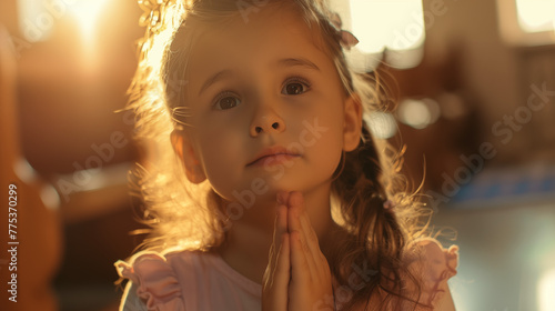 Cute little girl praying 