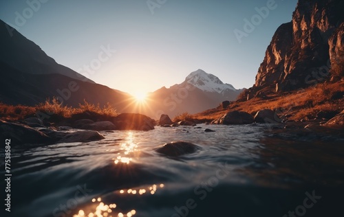 Serene Sunset Over Snow-Capped Mountain Range With Stream