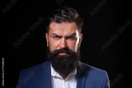 Barber concept. Beard man. Beard care concept. The bristle irritated his skin. Shampoo and conditioner for a bearded man. Male beauty care, facial hair care. Beard oil. Long beard care.