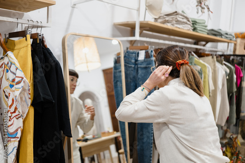 Woman Trying on Accessories in Clothing Store photo