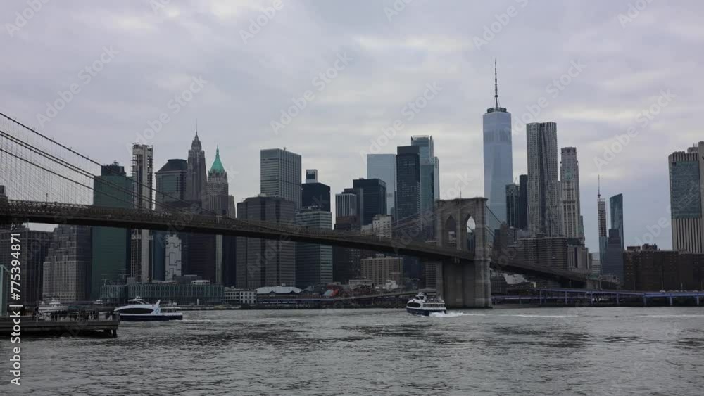 boats passing under the brooklyn bridge with view of nyc skyline (sunset new york city east river) waterfront harbor historic landmark travel tourism destination downtown boats passing under the brooklyn bridge with view of nyc skyline (sunset new york city east river) waterfront harbor historic landmark travel tourism destination downtown