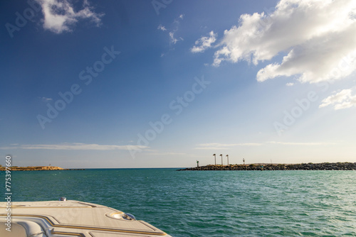 a beautiful spring landscape with the rippling blue waters of the Pacific Ocean at sunset sailing on a boat in Kapolei Hawaii USA © Marcus Jones