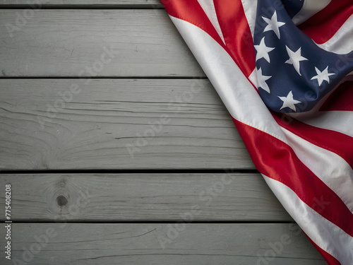 The flag of the United States is displayed on a grey plank background in honour of Memorial Day.