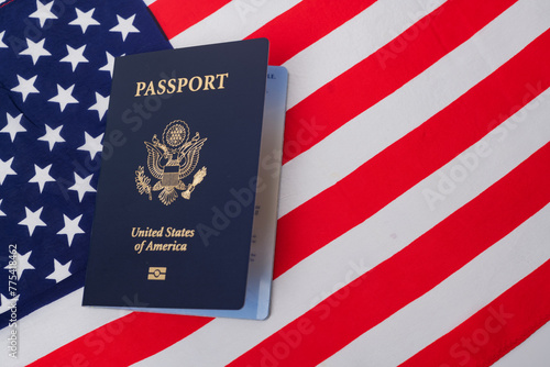 American passport of a US citizen against the background of the American flag.
