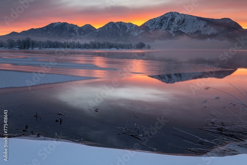Mountains reflected in lake, dawn, fog, winter, snow, icy, Lake Kochel, Alpine foothills, Bavaria, Germany, Europe photo