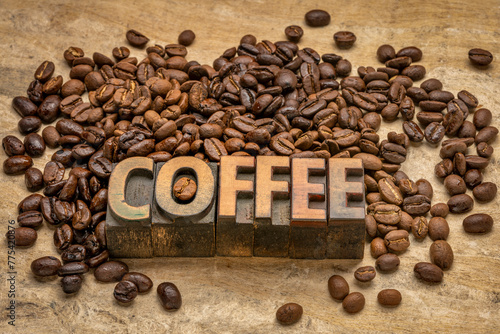 sampler of coffee beans from different parts of the world with coffee word in vintage letterpress wood type