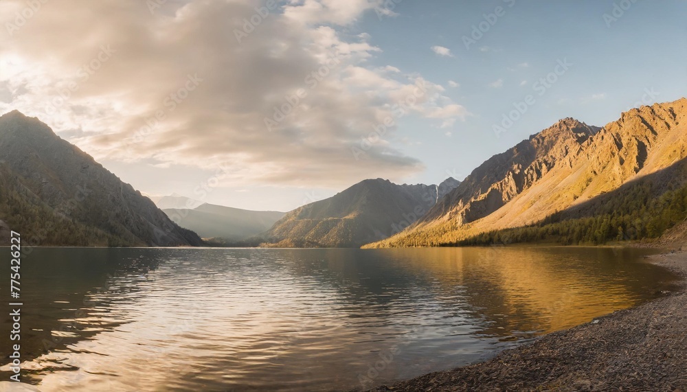panoramic view on mountain lake in front of mountain range during sunset national park in altai republic siberia russia