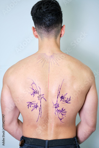 Back Tattoo Preparation on an unrecognizable Male Client photo