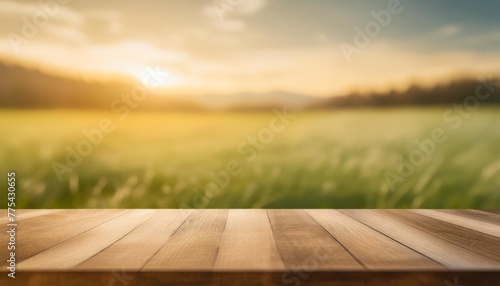 beautiful spring green meadow background with empty wooden table for product display nature blurred background copy space