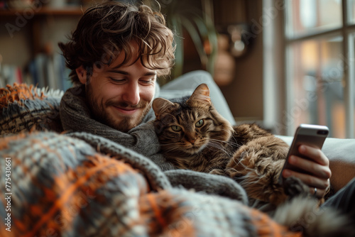 Happy White Man with Cat Enjoying Smartphone at Home