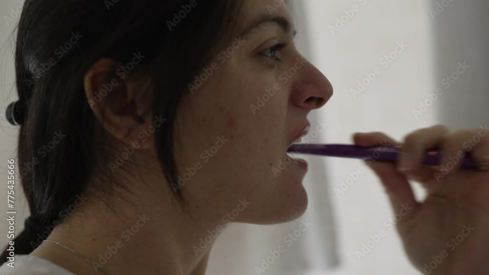 Close-Up of Woman Brushing Teeth, Everyday Morning Dental Hygiene Ritual Close-Up of Woman Brushing Teeth, Everyday Morning Dental Hygiene Ritual