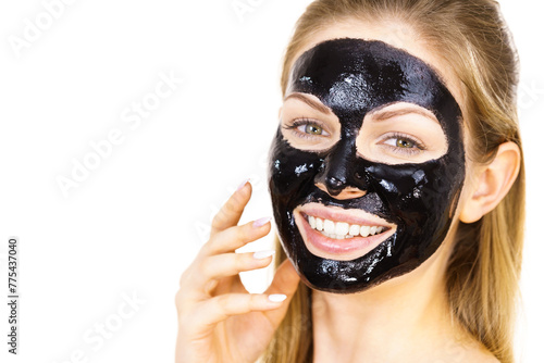 Woman with black peel off mask on face