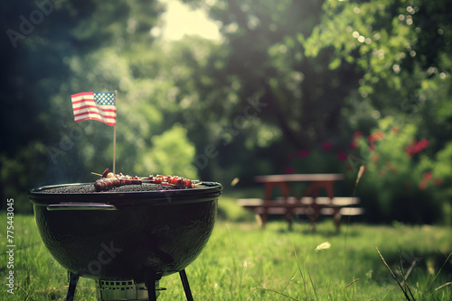 July 4 celebration: American flag proudly waving at a barbecue in the park, symbolizing unity and freedom photo