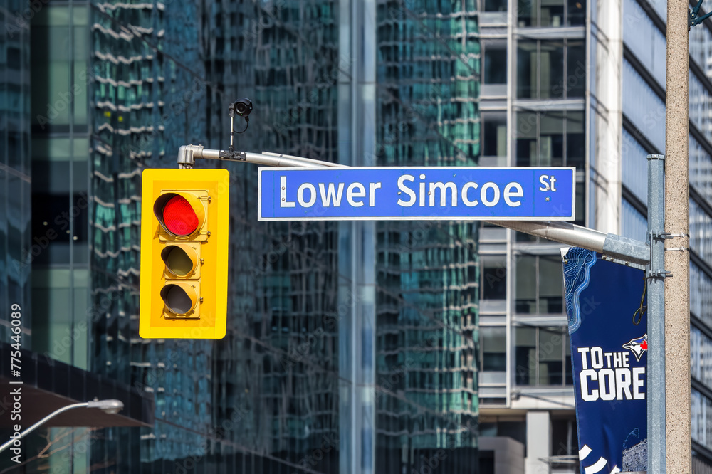 Fototapeta premium Street sign and stop light in downtown Toronto, Canada