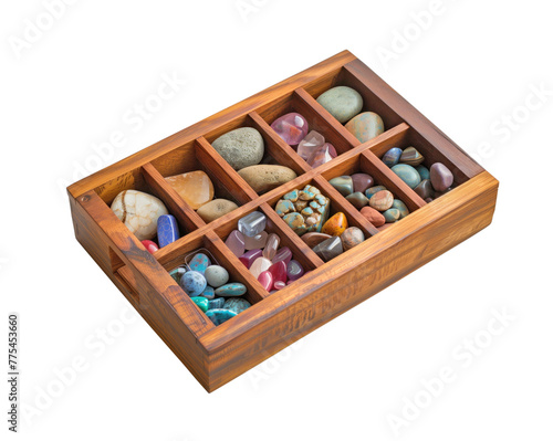 A wooden box filled with a variety of colorful stones and gems. The box is rectangular and has a wooden partitionы. The stones and gems are of different shapes and sizes