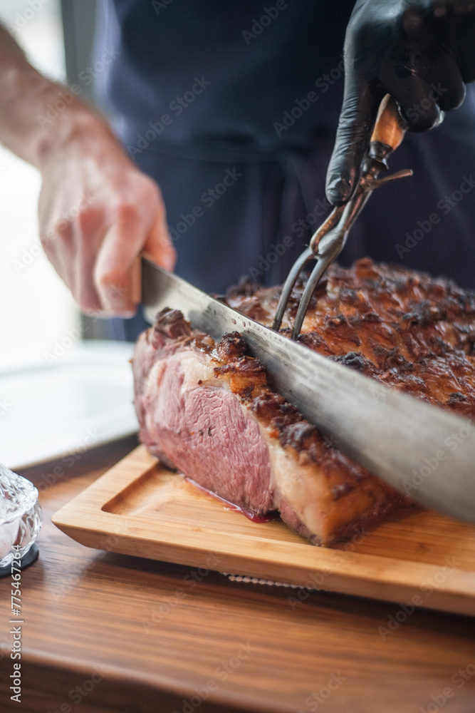 Chef cutting gourmet steak