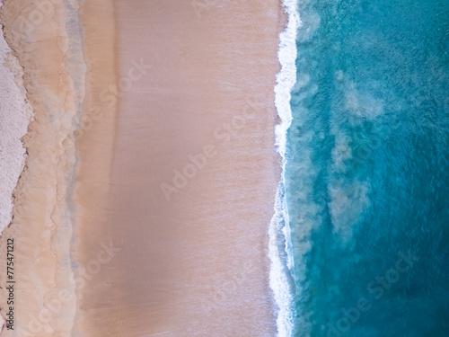 Amazing Top view sea beach landscape background,Summer sea waves crashing on sandy shore seascape background,High angle view ocean nature background © panya99