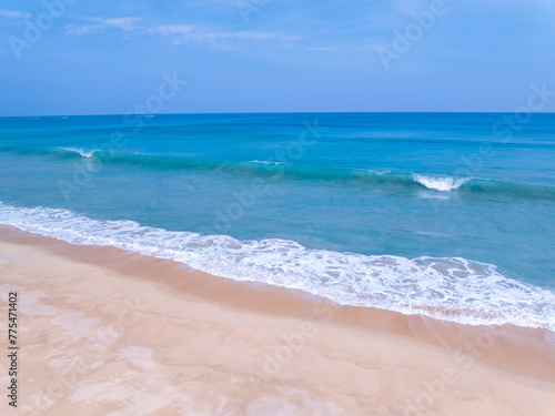 Amazing sea beach with ocean wave foams.Beautiful nature beach sand sea surface,Waves crashing on sand,Wide angle lens