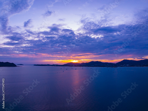 Aerial view sunset sky, Beautiful Light Sunset or sunrise over sea,Colorful dramatic majestic scenery sunset Sky, Amazing clouds and small waves in the ocean, Wonderful light cloud background