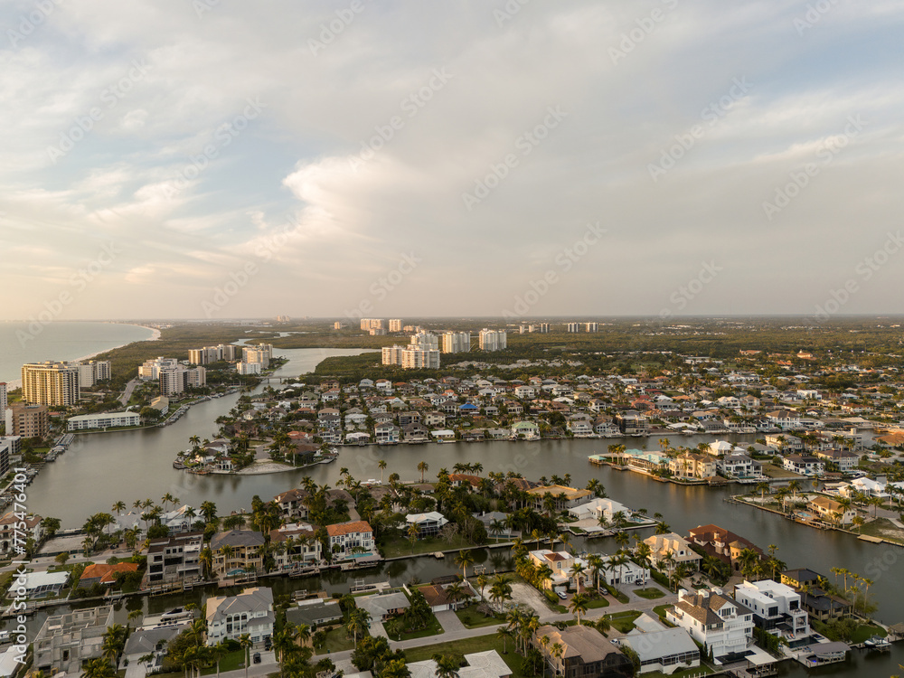 Sunset aerial sky view of Vanderbilt Beach and the ocean