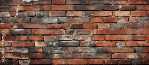 A detailed close-up of a weathered brick wall covered in an abundance of rust, showing signs of deterioration and age