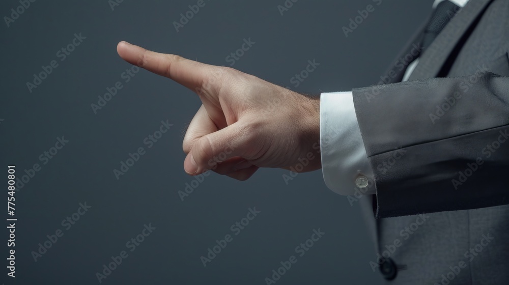 Businessman's Hand in Grey Suit Jacket Pointing