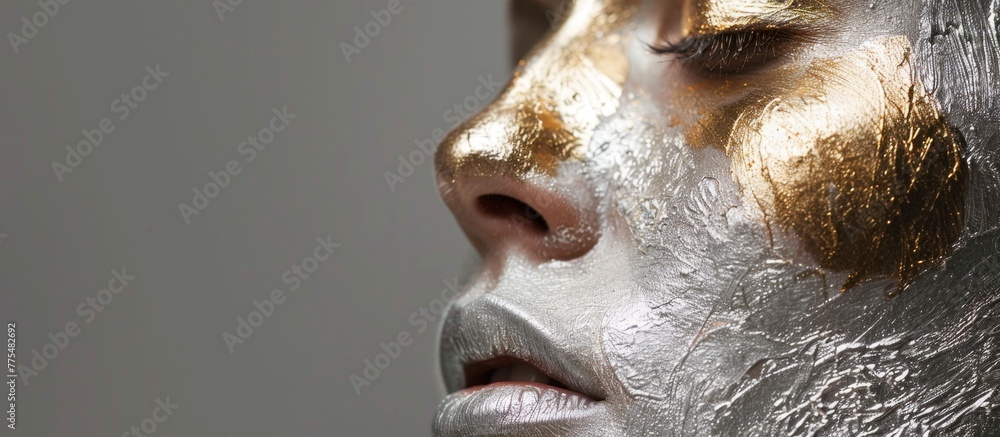 Woman with gold and silver paint on her face Woman with gold and silver paint on her face