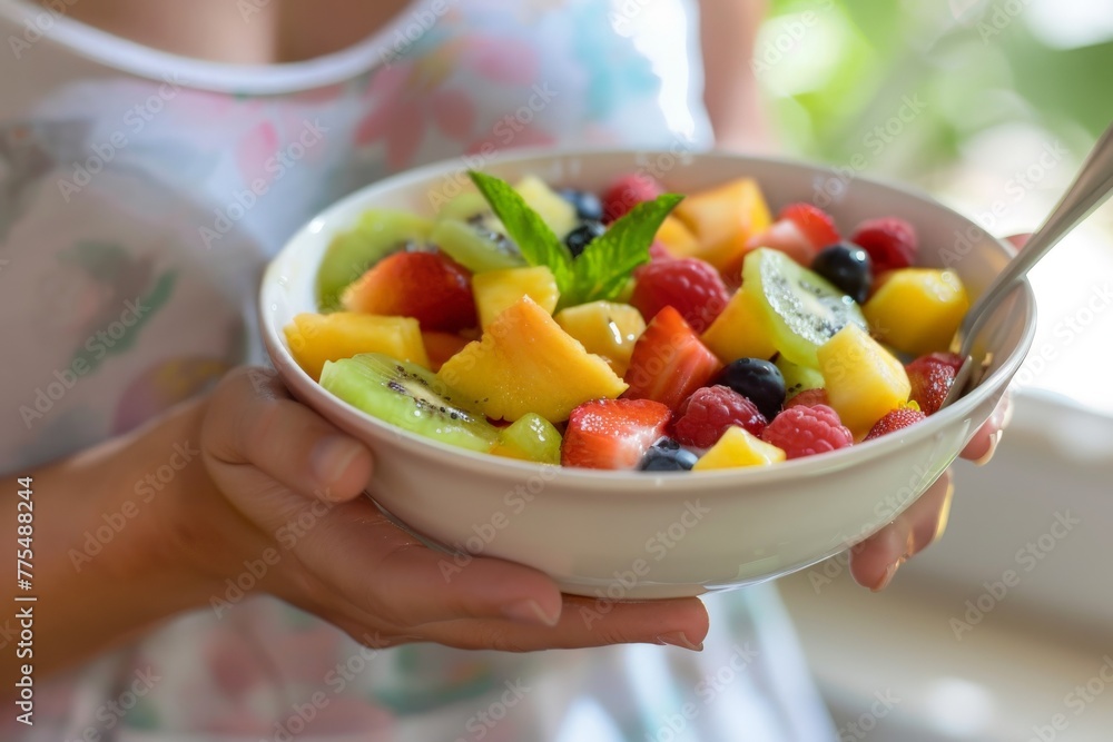 Fresh fruit salad from raw pieces in a white bowl in the hands of a young woman, Generative AI Fresh fruit salad from raw pieces in a white bowl in the hands of a young woman, Generative AI