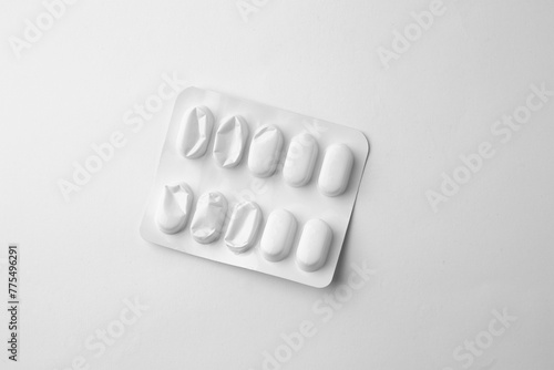 Pills in white package isolated on white background
