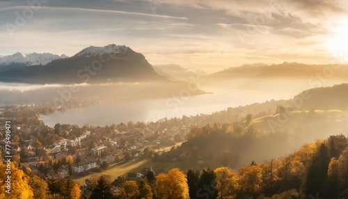 outstanding autumn view on suburb of stansstad city and lucerne lake with mountaines and fog