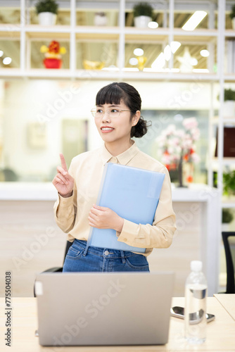 Office white collar worker holding folder in hand