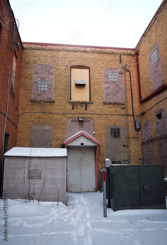 Secluded Area with Brick Buildings Converging in Urban Alleyway During Winter