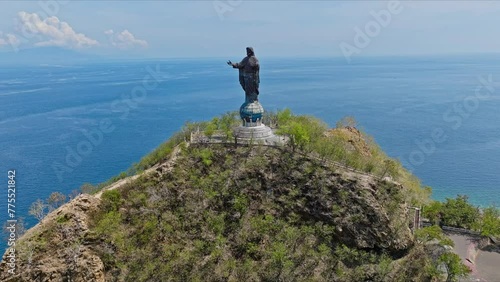 Cape Fatucama, Dili, East Timor - Cristo Rei of Dili (Christ the King of Dili) Statue - Aerial Pullback Shot photo