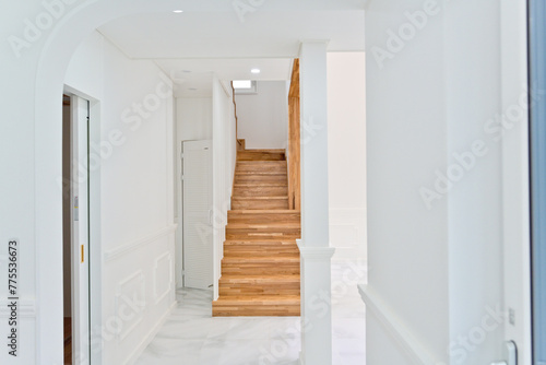 Light colored wooden staircase interior made from maple wood © Daewan