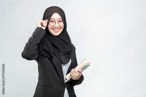 Business woman, Business, An office worker for an Asian Muslim woman stands with arms crossed with a happy face and a commitment to work, on white background.