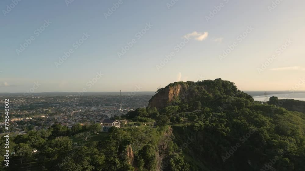 San Fernando Hill, Trinidad and Tobago. Wide shot Aerial Drone left to right motion. Sunset evening light, scenic blue sky. South facing San Fernando Hill, Trinidad and Tobago. Wide shot Aerial Drone left to right motion. Sunset evening light, scenic blue sky. South facing