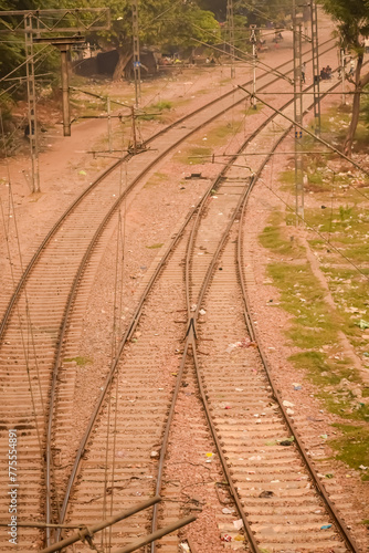 View of train Railway Tracks from the middle during daytime at Kathgodam railway station in India, Train railway track view, Indian Railway junction, Heavy industry photo