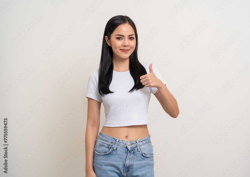 Beautiful thumbs up happy young asian woman age around 25. Charming female lady standing pose on isolated white background. Asian attractive woman people looking camera confident with backdrop. Beautiful thumbs up happy young asian woman age around 25. Charming female lady standing pose on isolated white background. Asian attractive woman people looking camera confident with backdrop.
