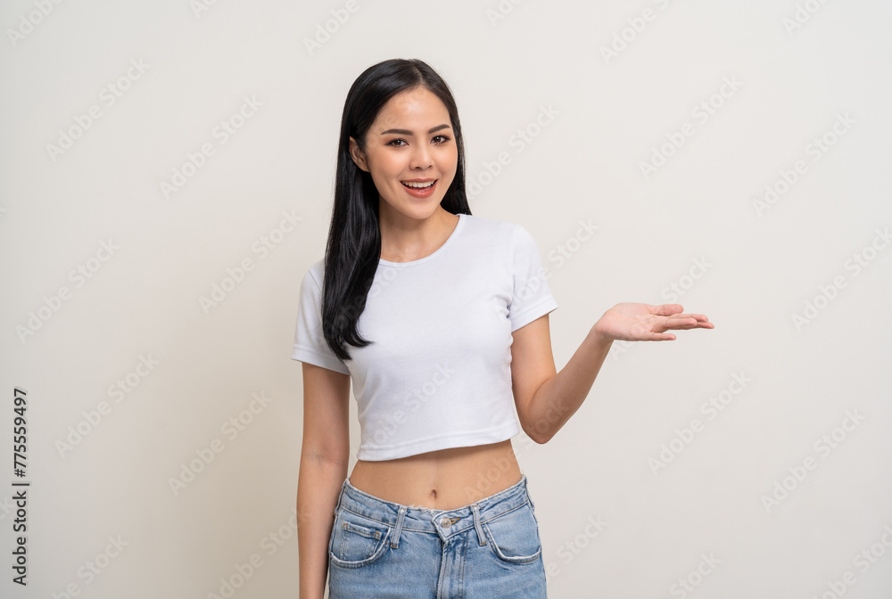 Beautiful smiling happy young asian woman in white shirt. Charming female lady open hands palm up holding something on isolated white background. Asian woman cute Pretty people looking blank space. Beautiful smiling happy young asian woman in white shirt. Charming female lady open hands palm up holding something on isolated white background. Asian woman cute Pretty people looking blank space.