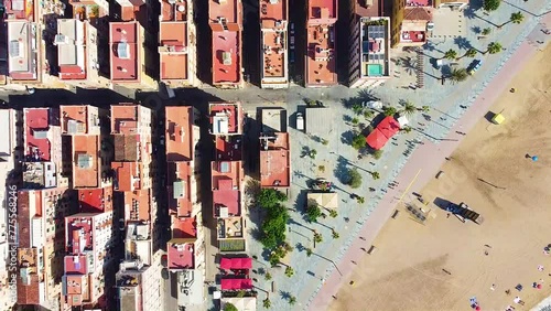 Aerial view of the residential district of Barceloneta Beach. Drone footage moving away from the ground. Neighbourhood. Buildings. Houses. Drone footage. Summer. Barcelona. Spain. July. photo
