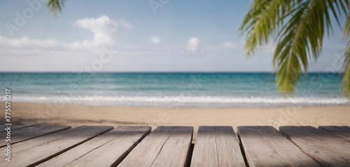 Top of wood table with seascape and palm leaves  blur light of calm sea and sky at tropical beach background. Empty ready for your product display montage. summer vacation background