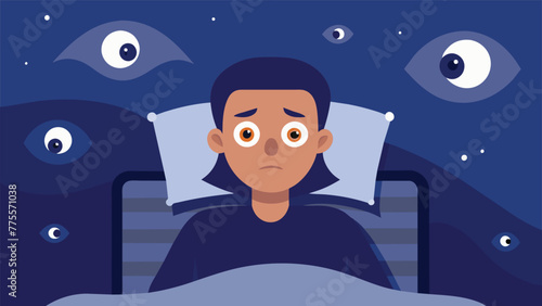 A person lying awake in bed with eyes wide open depicting the insomnia commonly experienced by individuals with PTSD and the toll it takes on