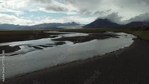 Aerial drone panorama of amazing icelandic glacier at hoffell, visible the tongue approaching the ground and water flowing from below. photo