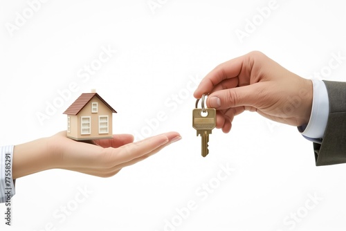 A man and a woman are holding a house and a key. The man is wearing a suit and the woman is wearing a dress. Concept of a transaction or exchange, possibly related to buying or selling a property