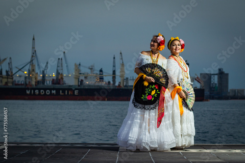 Dancers of traditional Veracruz music on the port's boardwalk. photo